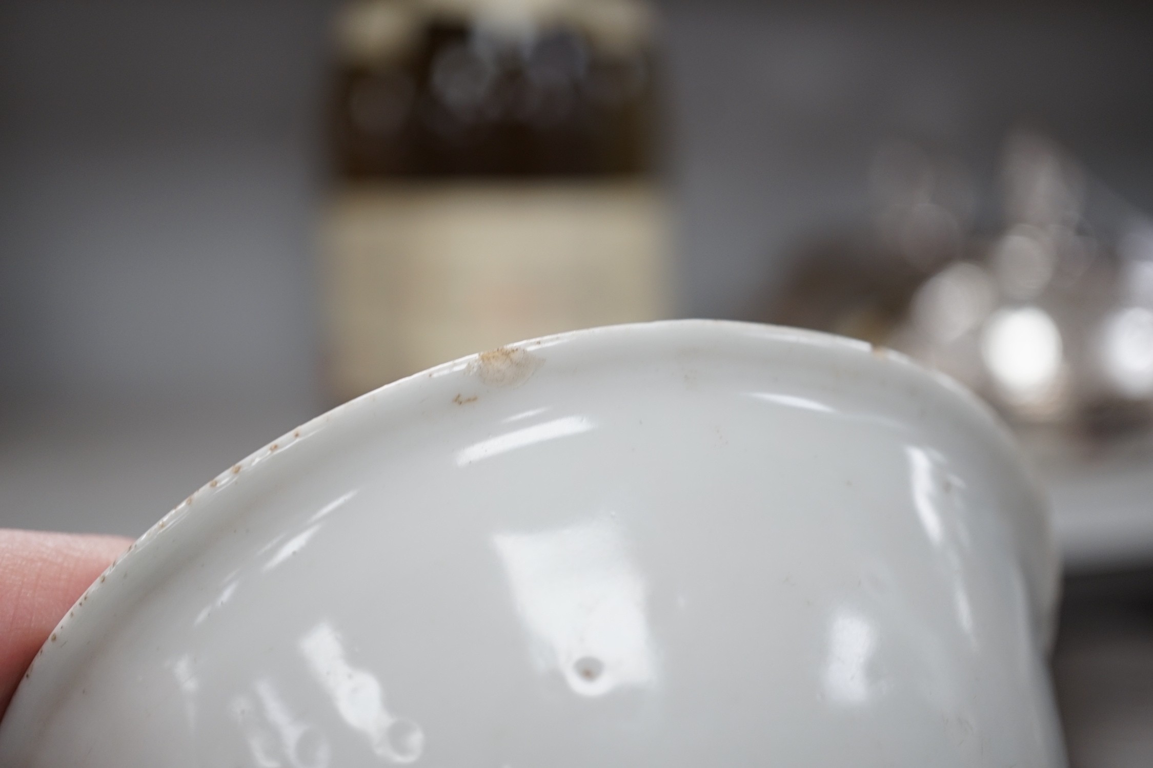 A Chinese late Ming blue and white lion-dog bowl, the base with ‘Made in the Great Ming dynasty’ mark, white exterior, 13cm diameter